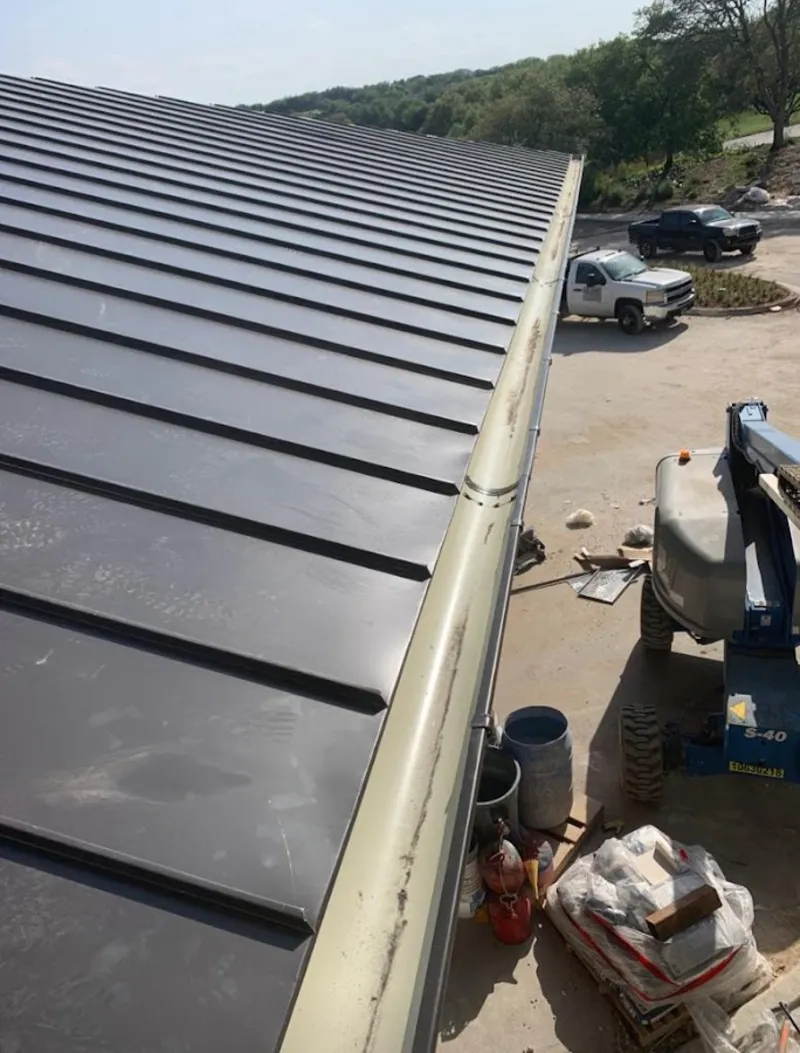 Standing seam panel and gutter detail on a metal roofing jobsite in Santa Barbara